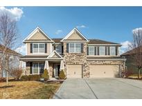 Beautiful two-story home featuring a three-car garage and a well-maintained front yard at 10122 Pepper Tree Ln, Noblesville, IN 46060
