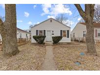 Charming single-story home featuring a well-maintained lawn and classic architectural details at 1120 N Berwick Ave, Indianapolis, IN 46222