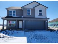 Charming two-story home featuring gray siding and a spacious two-car garage, perfect for modern living at 3251 W Keepsake Ln, Monrovia, IN 46157
