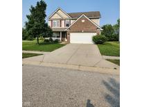 Two story home with brick facade, attached garage, and small front porch in a well-kept community at 3416 Firethorn Dr, Whitestown, IN 46075