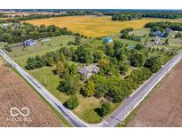Expansive aerial view showcases a large home with mature trees on a sprawling, well-maintained lawn at 4030 W 193Rd St, Westfield, IN 46074