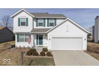 Charming two-story home with white siding, a well-maintained lawn, a two-car garage, and lovely landscaping at 644 Downing Dr, Greenwood, IN 46143