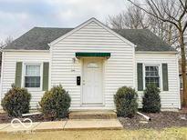 Charming bungalow features a well-maintained lawn, complemented by neat shrubbery flanking the entrance and inviting curb appeal at 2011 N Hollywood Ave, Muncie, IN 47304