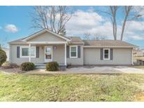 Charming single story home with neutral siding, landscaped front yard, and inviting covered entry at 4220 S Gerrard Dr, Indianapolis, IN 46221