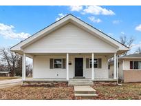 Charming single-story home featuring a cozy front porch and classic white siding at 1533 Castle Ave, Indianapolis, IN 46227