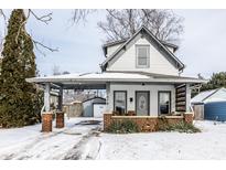 Charming two-story home with covered front porch and convenient carport at 1676 Cherry St, Noblesville, IN 46060