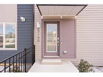 Modern home featuring a stylish front door with glass panel and address numbers at 2149 N College Ave, Indianapolis, IN 46202