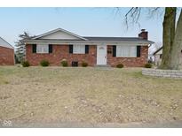 Charming brick home featuring well-maintained landscaping and a classic design at 25 Angela Ct, Beech Grove, IN 46107