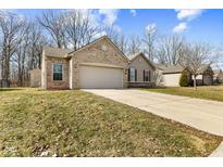 Charming single Gathering home with brick accents and attached two car garage at 4162 S Woodtrail Ln, New Palestine, IN 46163