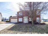 Two-story brick home with a well-maintained lawn and attached two-car garage at 6116 Bartley Ct, Indianapolis, IN 46236