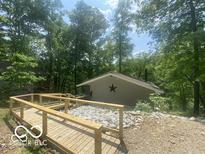 Charming single-story house with a wooden ramp and a decorative star on the front at 8381 S Kinman Dr, , IN 46164