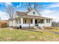 Charming two-story home with a welcoming front porch and well-maintained lawn at 114 E Mill St, Brooklyn, IN 46111