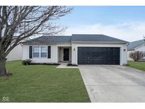 Charming single-story home featuring a well-maintained lawn and black two-car garage door at 1341 Valley Forge Dr, Indianapolis, IN 46234