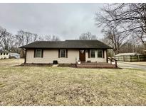 Charming single-story home featuring neutral siding and a cozy front porch at 1921 E State Road 42, Mooresville, IN 46158