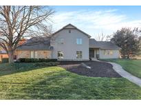 Charming two-story home with a stone facade and beautifully landscaped front yard at 3517 Brumley Way, Carmel, IN 46033