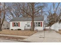 Charming home showcasing its curb appeal with a well-manicured lawn and inviting facade at 518 E College Ave, Brownsburg, IN 46112