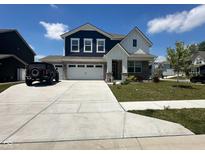 Charming two-story home featuring a three-car garage and beautiful landscaping at 1256 Turner Trace N Pl, Avon, IN 46123