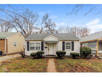 Charming home with a well-maintained yard and classic architectural details at 3331 Orchard Ave, Indianapolis, IN 46218
