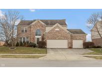 Charming two-story brick home with well-maintained landscaping and a three-car garage at 422 Letterman Dr, Brownsburg, IN 46112