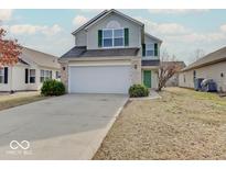 Charming two-story home featuring a two-car garage, green door and shutters, and a well-maintained front yard at 435 Vernon Pl, Westfield, IN 46074