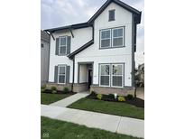 Charming two-story home with white siding, gray trim, and manicured front yard at 780 James William Ln, Westfield, IN 46074