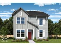 Charming two-story home showcasing classic architectural style with a well-manicured front yard and inviting red door at 780 James William Ln, Westfield, IN 46074