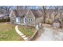Charming stone home with a well-manicured yard and a convenient two-car garage at 8937 W 800 N, Indianapolis, IN 46259