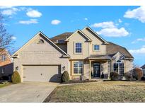 Charming two-story home with a well-manicured lawn and inviting curb appeal, perfect for Gathering living at 1714 Decourcy Ln, Franklin, IN 46131
