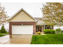 Charming single-Gathering home with brick and siding exterior, attached two-car garage, and well-manicured lawn at 5650 Goodwin St, Indianapolis, IN 46234