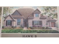Charming single-Gathering home with a brick facade, manicured lawn, and an optional three-car garage at 4248 Stone Lake Dr, Zionsville, IN 46077