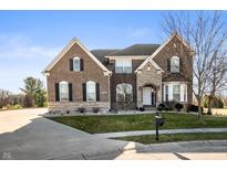 Beautiful two-story brick home featuring well-manicured lawn and professional landscaping at 4431 Hickory Stick Row, Greenwood, IN 46143