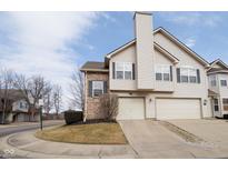 Charming townhome featuring a two-car garage, brick accents, and well-maintained landscaping at 475 Glenn Villa Ln # 144, Avon, IN 46123