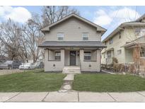 Charming home features a welcoming front porch and well-maintained lawn at 536 N Gray St, Indianapolis, IN 46201