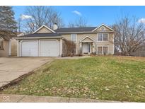 Charming two-story home with a well-manicured front yard and attached two car garage at 544 Hunters Trl, Greenwood, IN 46142