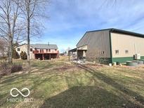 Expansive backyard view with a large metal outbuilding, perfect for storage or hobbies at 7811 W 700 S, Jamestown, IN 46147