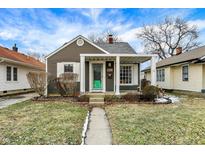 Charming home with a well-maintained front yard, covered entry, and appealing exterior features at 118 S 11Th Ave, Beech Grove, IN 46107