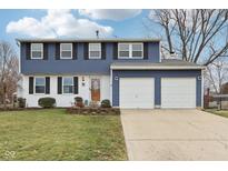 Charming two-story home with a well-manicured lawn and two-car garage at 455 Meadowview Ln, Greenwood, IN 46142