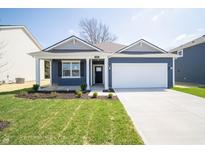 Charming single-Gathering home with a well-manicured lawn, two-car garage and covered porch at 5145 Cartland Dr, Indianapolis, IN 46239