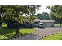 Charming single-story home with well-maintained lawn and inviting curb appeal at 11012 Brooks School Rd, Fishers, IN 46037