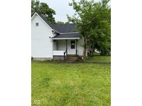 Charming home featuring a covered front entrance and green lawn at 2312 Fletcher St, Anderson, IN 46016