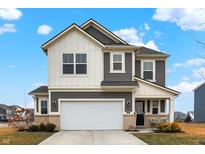 Charming two-story home featuring a two-car garage and nicely landscaped front yard at 9063 Moyer Pl, Pendleton, IN 46064