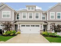 Charming townhome featuring an attached two car garage, manicured landscaping and inviting curb appeal at 9634 Beckett St, Avon, IN 46123