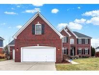 Charming two-story brick home with well-maintained lawn and attached two-car garage at 1057 Watertown Dr, Westfield, IN 46074