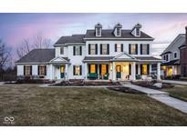 Stately two-story home featuring symmetrical design, dormer windows, and inviting front porch at 13139 Dumbarton St, Carmel, IN 46032