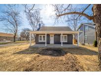 Charming home featuring a freshly painted exterior, inviting front porch and picturesque landscaping at 227 W 7Th St, Lapel, IN 46051