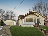 Charming single-Gathering home with a detached garage and a well-maintained front yard at 256 Ringwood Way, Anderson, IN 46013