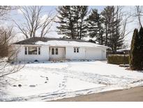 Charming single-story home with a fresh white exterior and attached two-car garage at 5686 Henderson Dr, Brownsburg, IN 46112