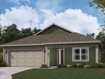 This is a single-story home with light green siding, beige accents, a grey roof and a two-car garage at 11305 N Quillow Way, Monrovia, IN 46157