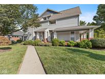 Charming two-story home with landscaped front yard and covered porch at 1322 N Alabama St # E, Indianapolis, IN 46202