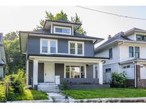 Charming home featuring new siding, complemented by a welcoming front porch and landscaped yard at 3543 N Kenwood Ave, Indianapolis, IN 46208